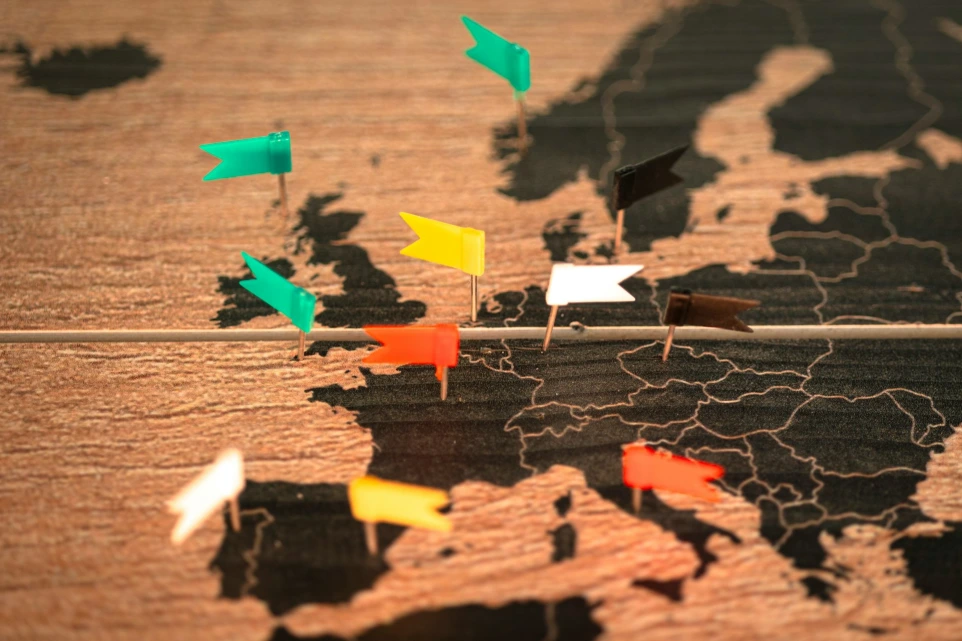 A map of the world with pins pointing in different directions